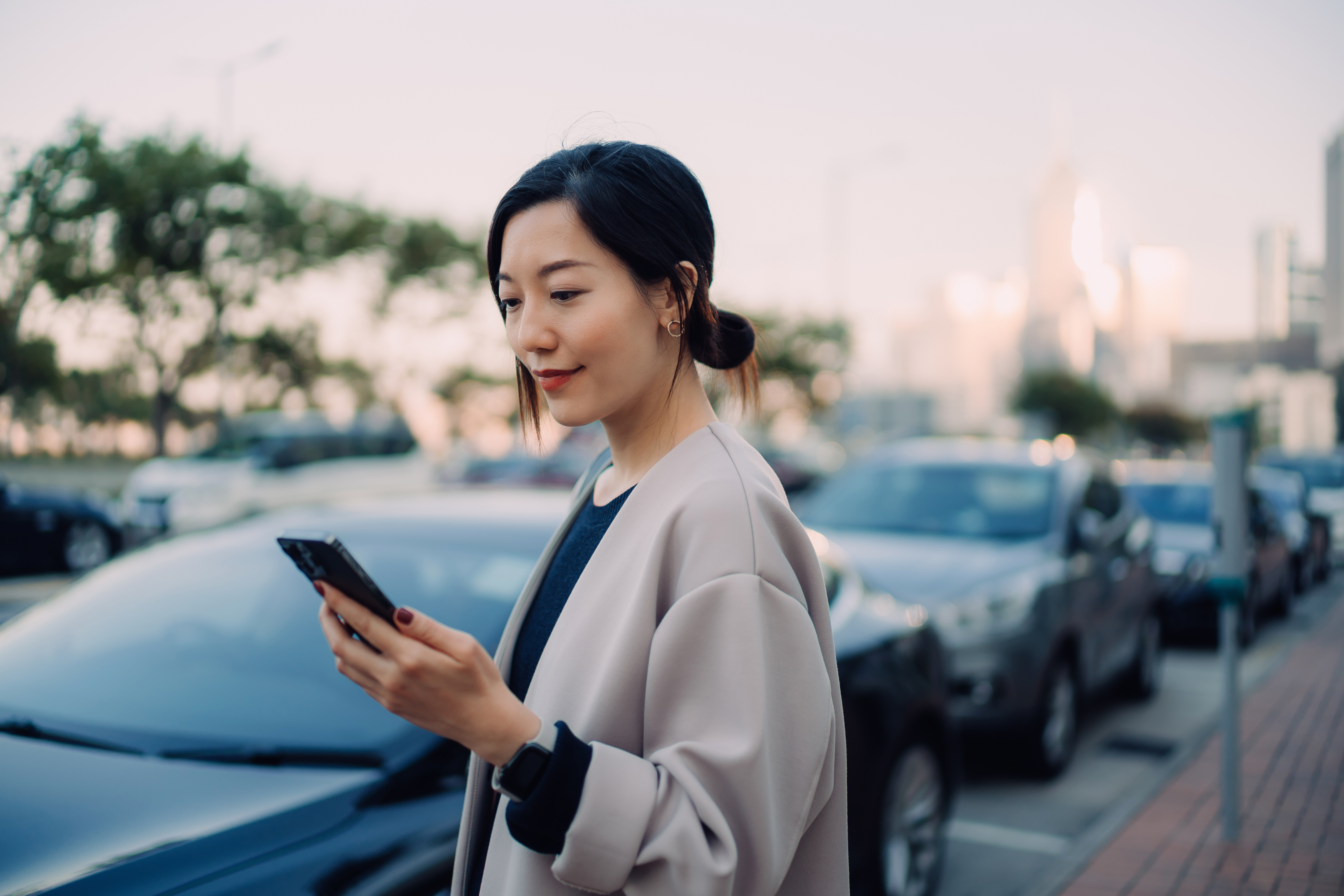 Image of woman looking at her mobile phone.