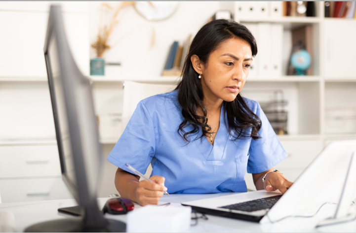 Clinician sitting in front of the computer 