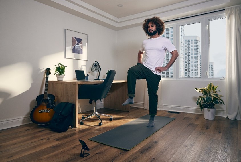 Man stretching at home